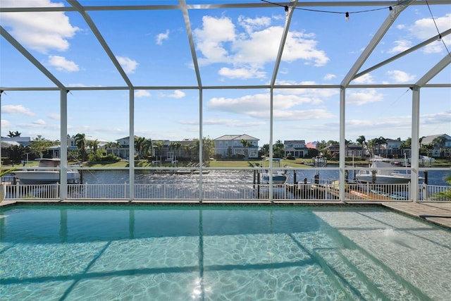 view of swimming pool featuring a lanai