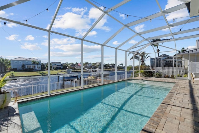 view of pool featuring a patio area and glass enclosure