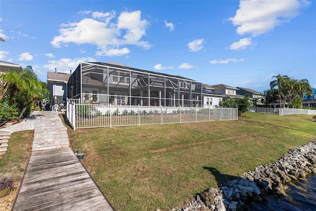 rear view of property featuring a yard