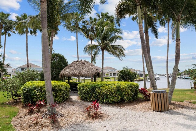 surrounding community with a gazebo and a water view