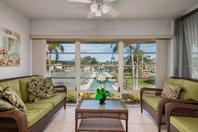 sunroom featuring ceiling fan and a wealth of natural light