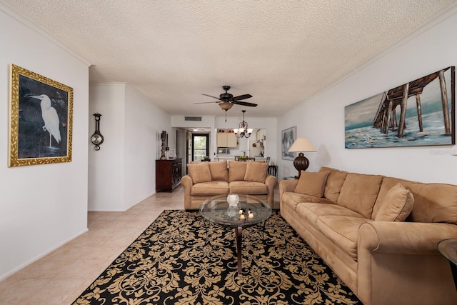 tiled living room with ceiling fan, crown molding, and a textured ceiling