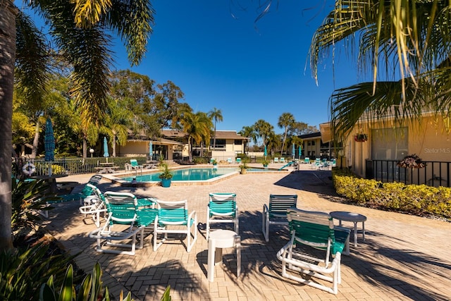 view of swimming pool featuring a patio area