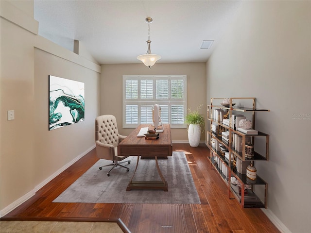 office with lofted ceiling and dark hardwood / wood-style floors