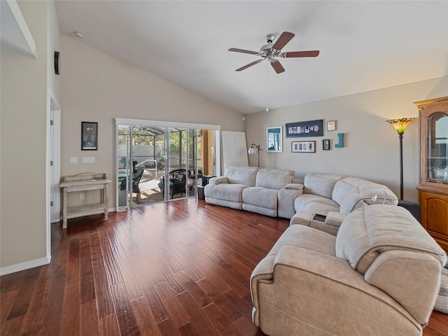 living room with lofted ceiling, dark wood-type flooring, and ceiling fan