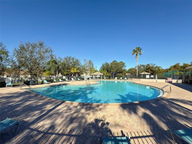 view of swimming pool with a patio