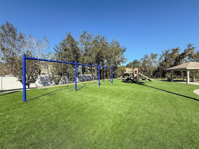 view of home's community featuring a gazebo, a yard, and a playground