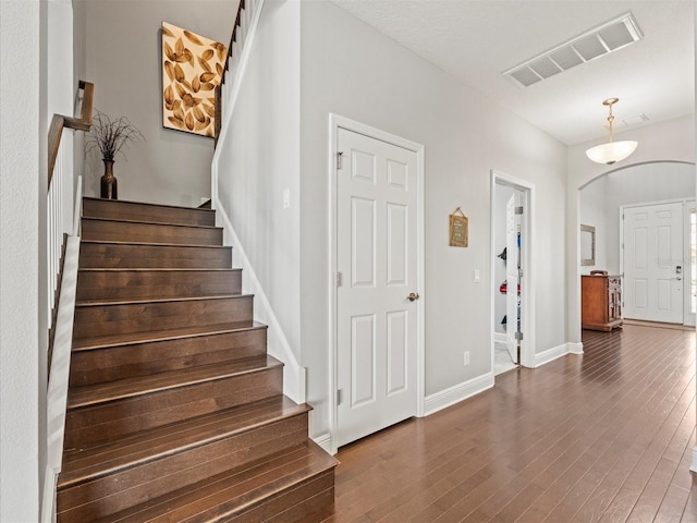 foyer featuring dark wood-type flooring