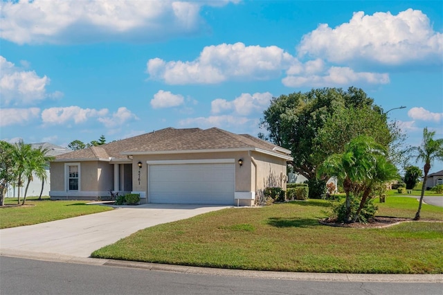 view of front of house featuring a garage and a front lawn