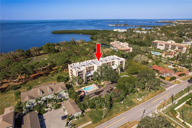 birds eye view of property with a water view