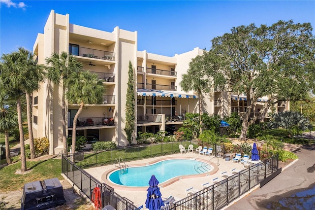 view of swimming pool featuring a patio area