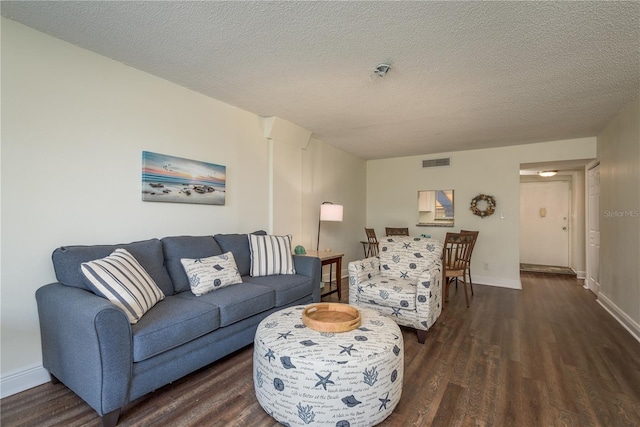 206 Tarpon Pt, Tarpon Springs, FL 34689 - living area featuring wood finished floors, baseboards, and a textured ceiling