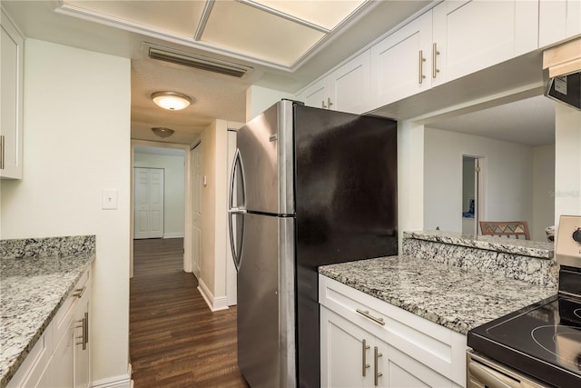 206 Tarpon Pt, Tarpon Springs, FL 34689 - kitchen featuring appliances with stainless steel finishes, dark wood-style floors, white cabinets, and light stone counters