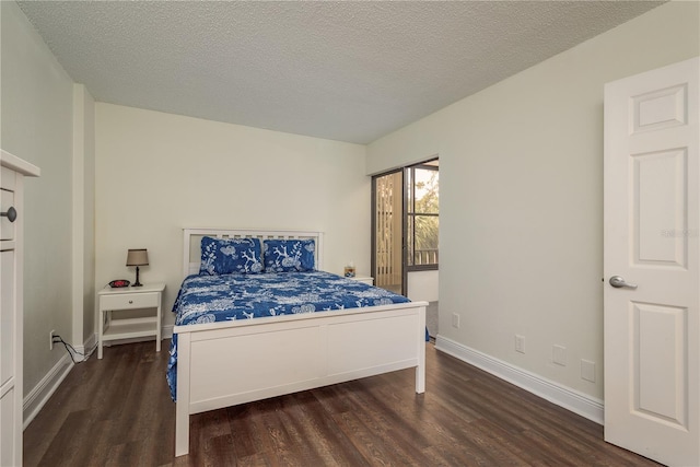 206 Tarpon Pt, Tarpon Springs, FL 34689 - bedroom featuring wood finished floors, a textured ceiling, and baseboards