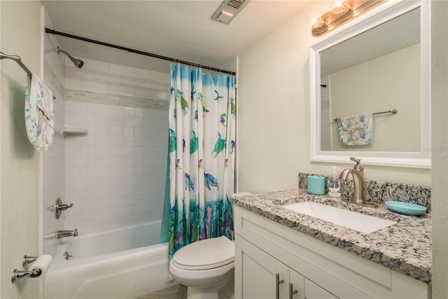 full bathroom with shower / bath combo, toilet, a textured ceiling, and vanity