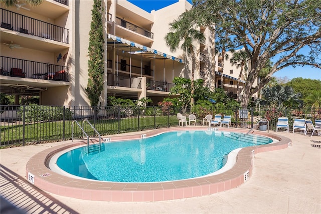 view of swimming pool featuring a patio