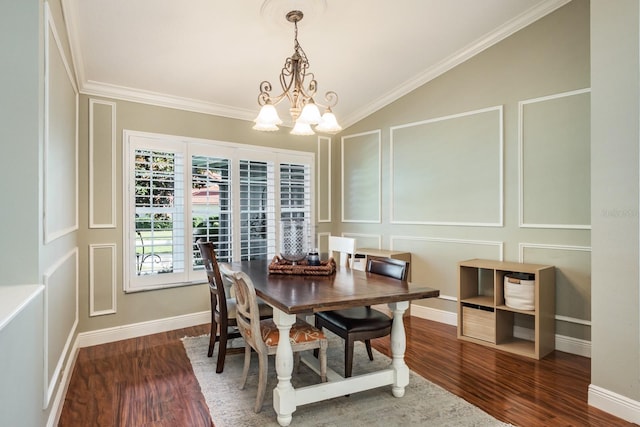 dining space featuring dark hardwood / wood-style flooring, vaulted ceiling, an inviting chandelier, and crown molding