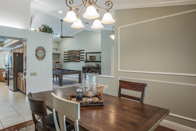 dining space with light tile patterned floors, billiards, vaulted ceiling, and ornamental molding