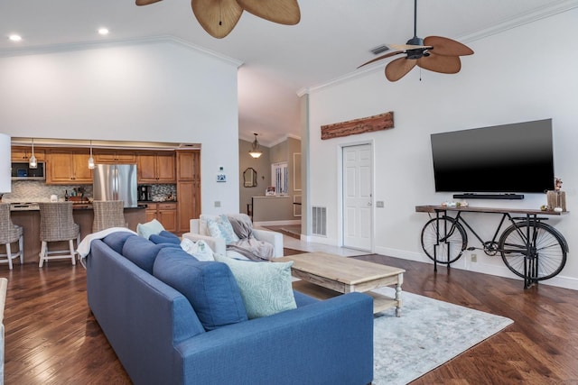 living room featuring crown molding, high vaulted ceiling, and dark hardwood / wood-style floors