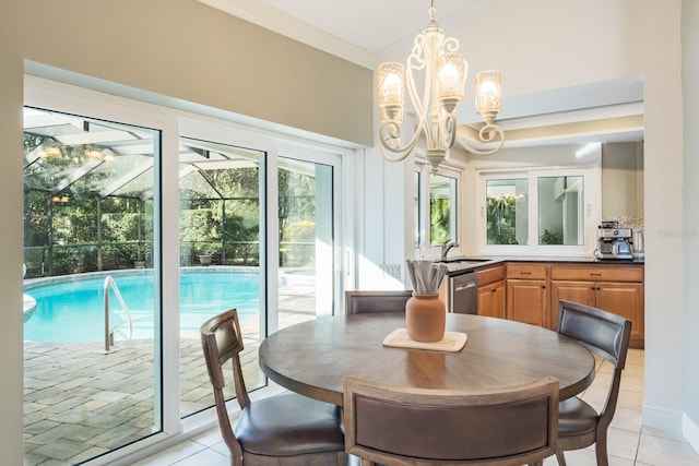 tiled dining area with sink and a notable chandelier