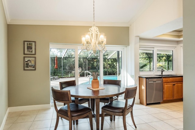 tiled dining room with crown molding, sink, and an inviting chandelier