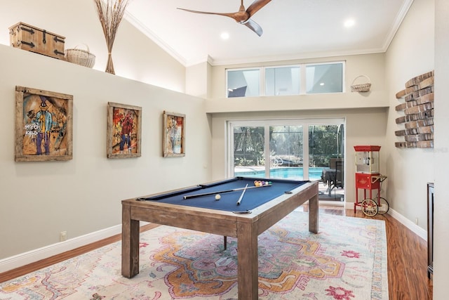 playroom with ceiling fan, crown molding, wood-type flooring, high vaulted ceiling, and billiards