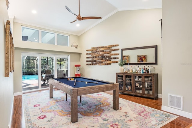 game room with ceiling fan, crown molding, and hardwood / wood-style flooring