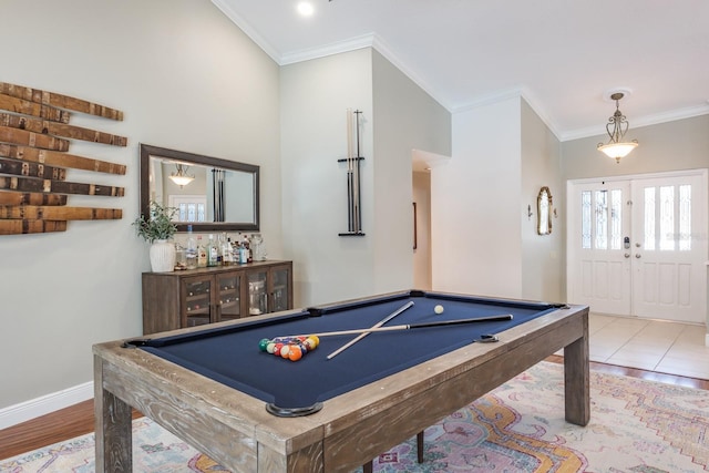 recreation room with crown molding, pool table, and light hardwood / wood-style flooring