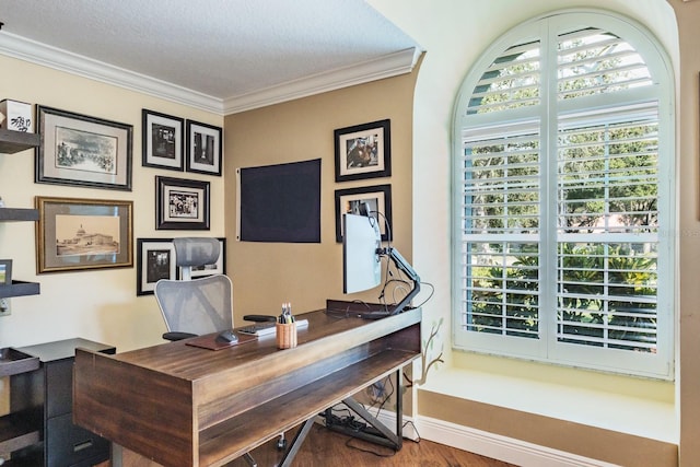 office featuring hardwood / wood-style floors, ornamental molding, and a textured ceiling