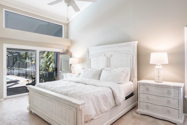 bedroom featuring access to outside, ceiling fan, high vaulted ceiling, and light colored carpet