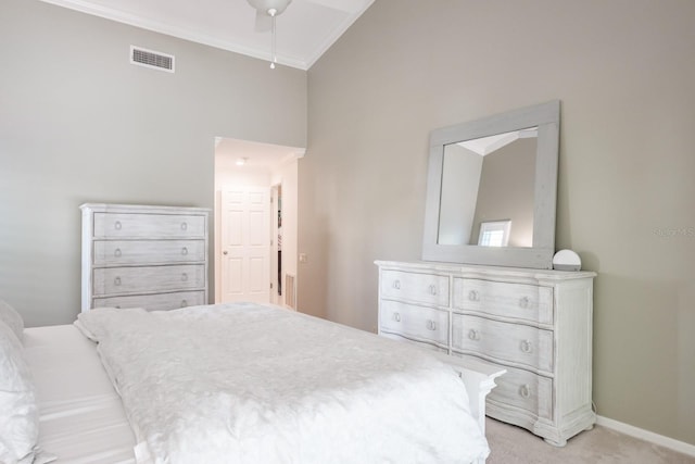 carpeted bedroom featuring crown molding, ceiling fan, and high vaulted ceiling