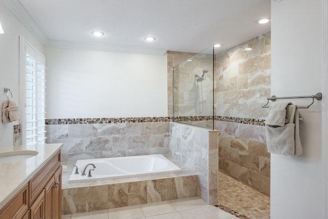 bathroom featuring tile patterned flooring, vanity, separate shower and tub, and crown molding