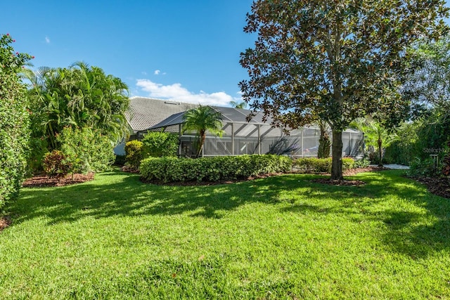 view of yard with a lanai