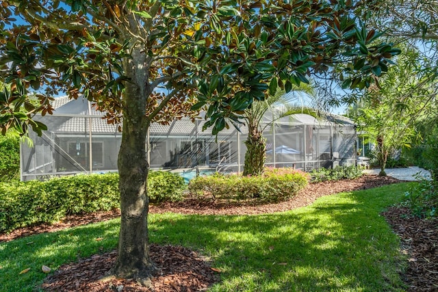 view of yard featuring a lanai