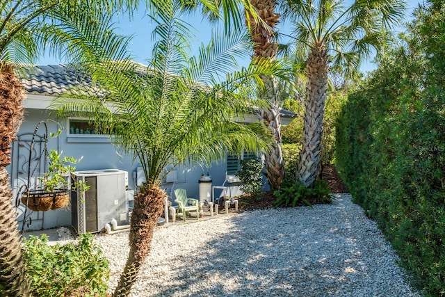 view of yard featuring a patio area and central AC