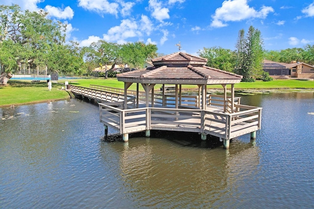 view of dock featuring a gazebo and a water view