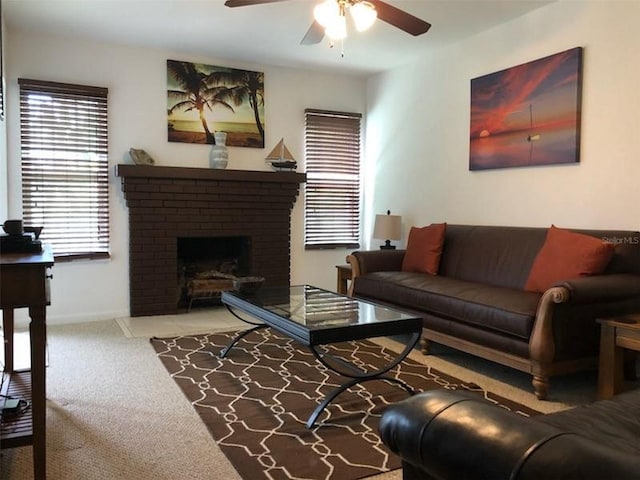 living room featuring carpet flooring, ceiling fan, and a fireplace