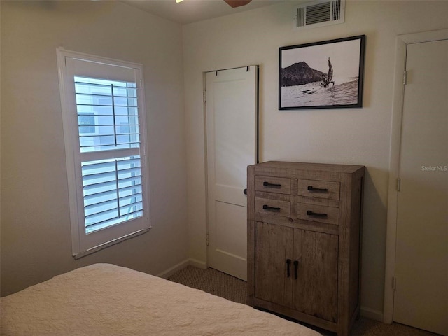 carpeted bedroom featuring ceiling fan