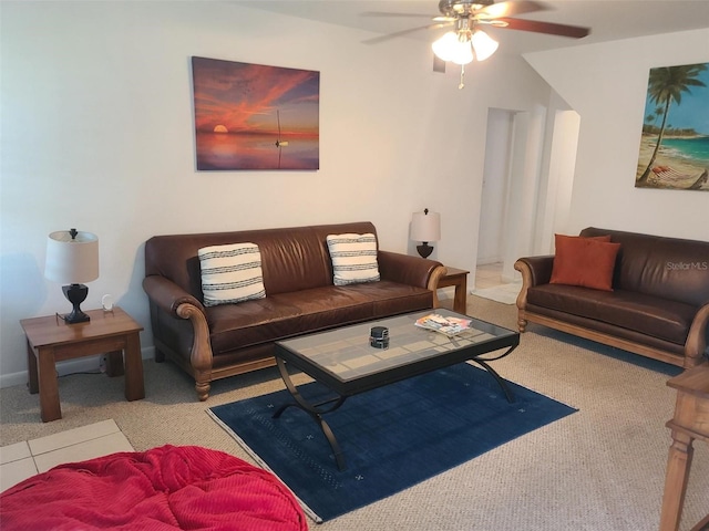 carpeted living room with ceiling fan