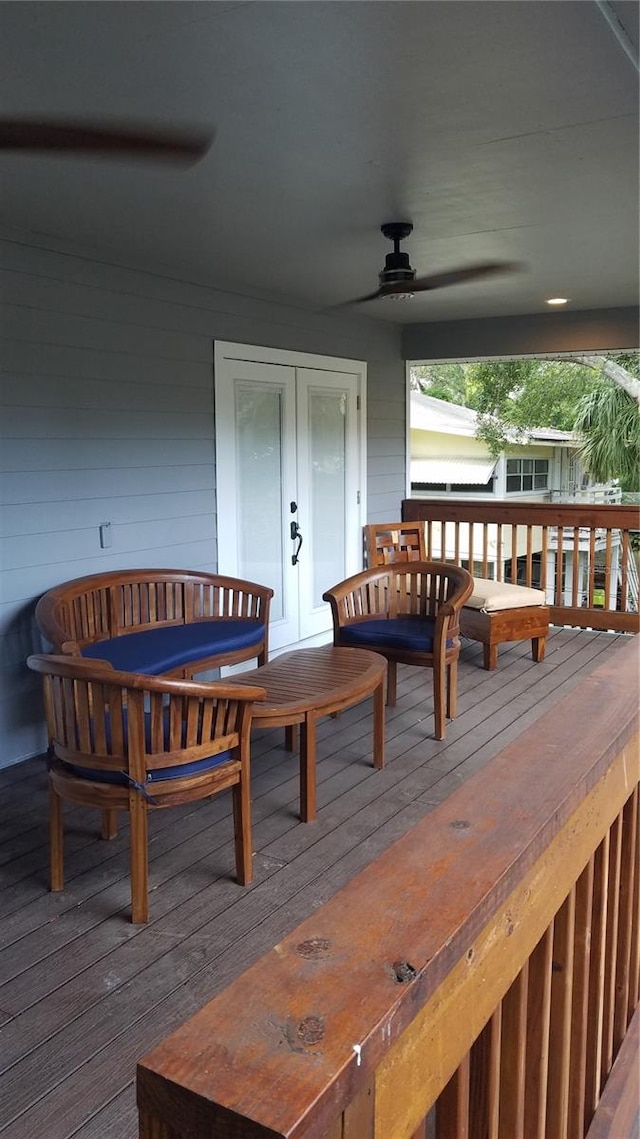 deck featuring ceiling fan and french doors