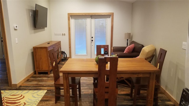 dining space with french doors and dark hardwood / wood-style floors