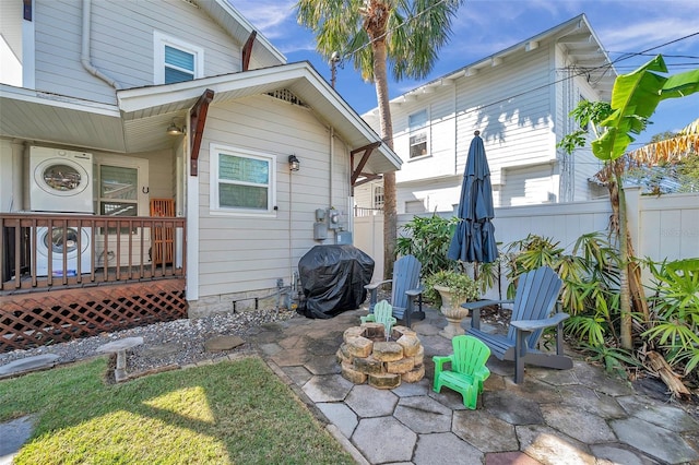 exterior space featuring a wooden deck and grilling area