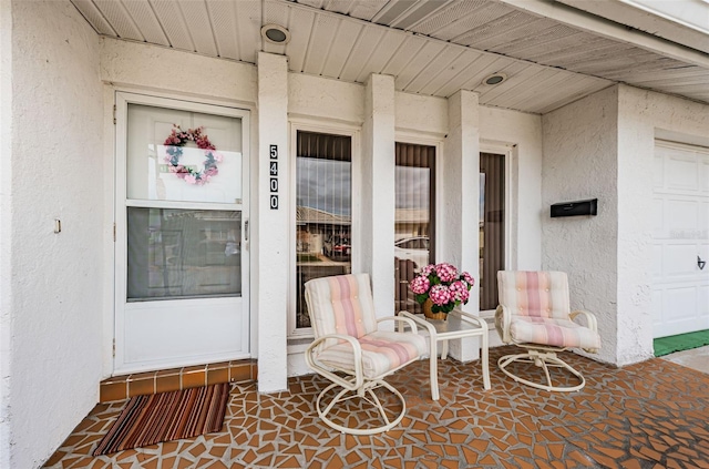 property entrance featuring stucco siding