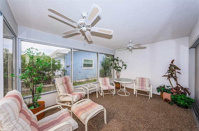 sunroom with ceiling fan