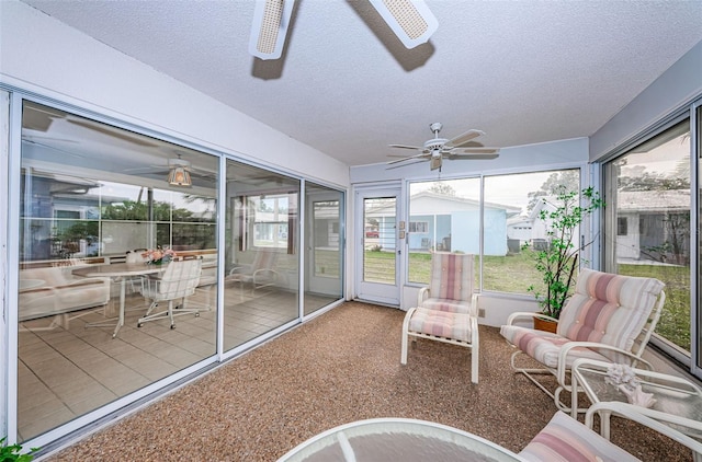 sunroom featuring a ceiling fan