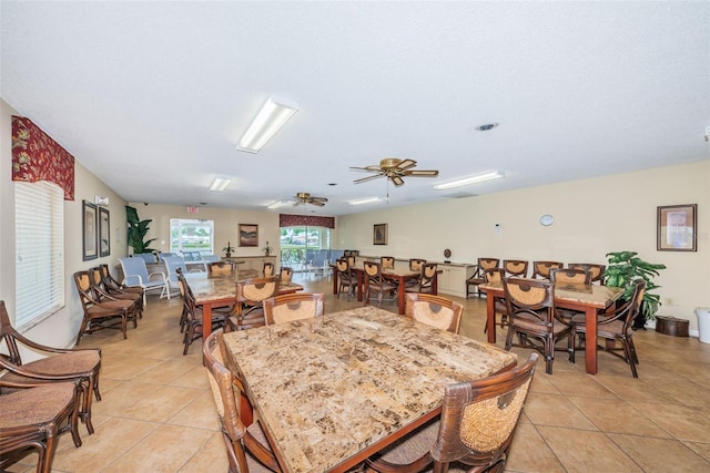 dining area featuring light tile patterned floors and ceiling fan