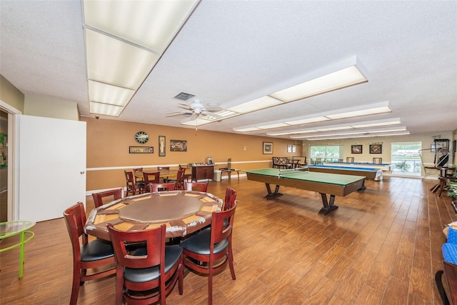 rec room featuring ceiling fan, hardwood / wood-style floors, a textured ceiling, and billiards