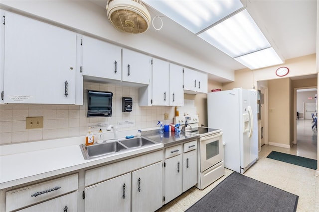 kitchen with decorative backsplash, white cabinetry, white appliances, and sink