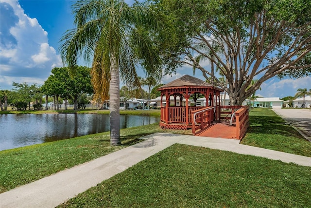 view of home's community featuring a water view, a lawn, and a gazebo