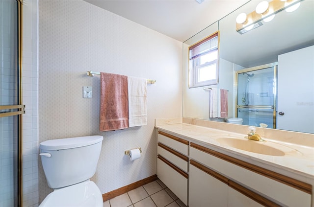 full bath featuring vanity, baseboards, tile patterned floors, a shower with door, and wallpapered walls